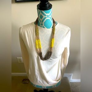 Multi strand beaded necklace in yellow and gold